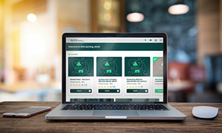 APM Learning dashboard view on laptop